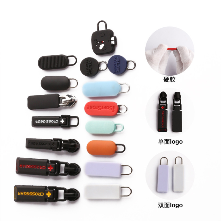 Collection of custom metal and rubber hybrid zipper pullers in various colors and shapes, featuring single-sided and double-sided logo capabilities.
